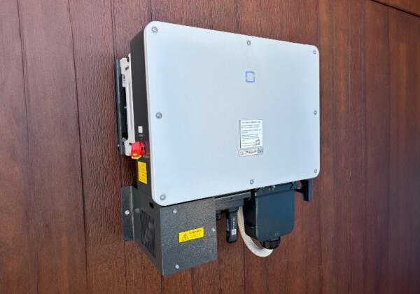 Solar inverter installed on wood paneling wall in Melbourne